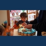 Grandma Lighting The Candles