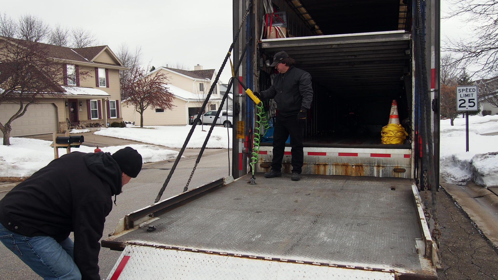Raising the huge tail gate.