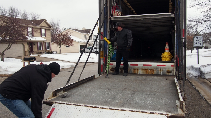 Raising the huge tail gate.