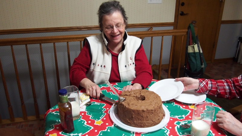 Holly cutting the cake